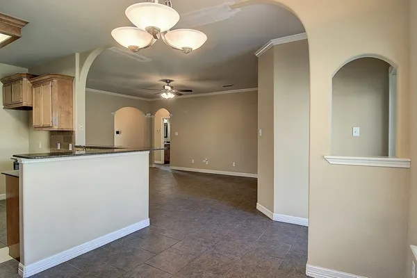 a view of a kitchen with a sink and a cabinet