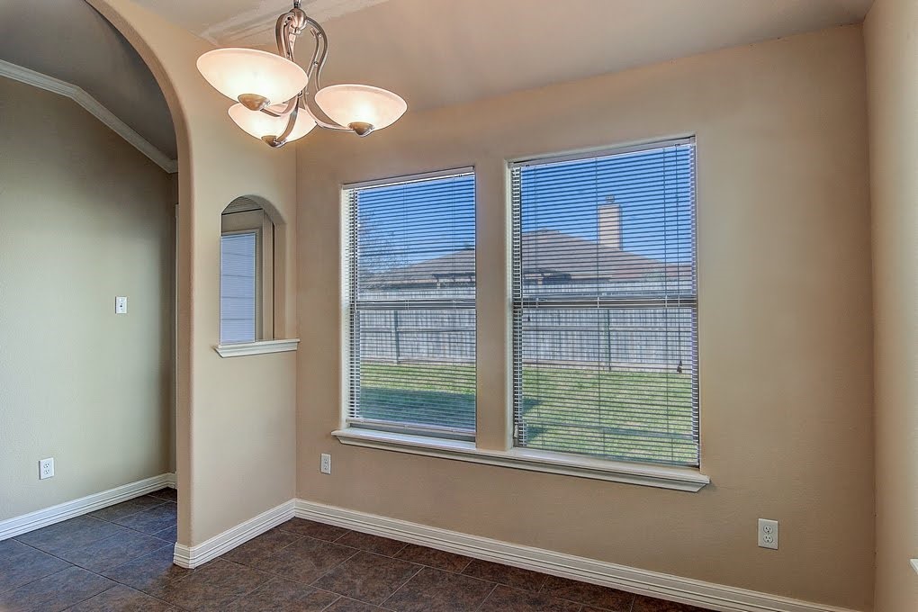 6824 Fox Tail Drive Corpus Christi, TX 78413 - Photo 36 of 40 a view of a room that has a large window and chandelier