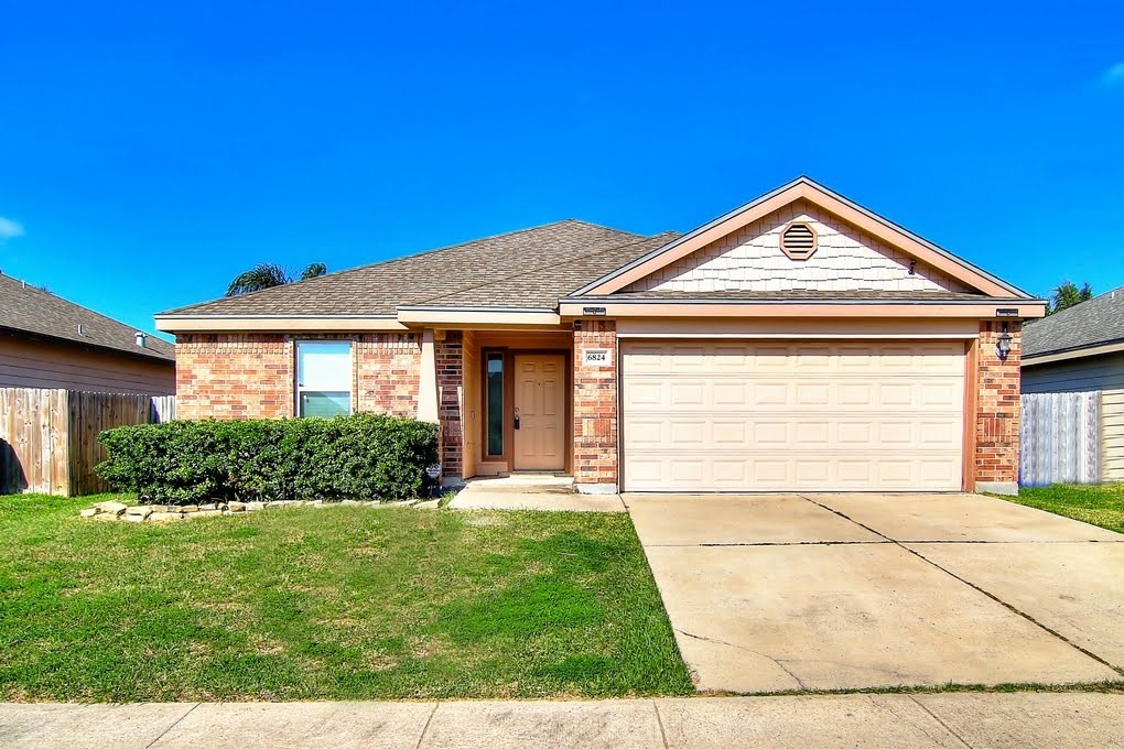 6824 Fox Tail Drive Corpus Christi, TX 78413 - Photo 39 of 40 a front view of a house with a yard