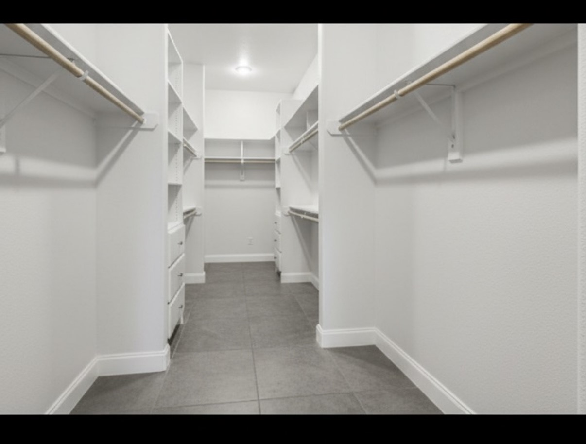 20547 Crosby Eastgate Road Crosby, TX 77532 - Photo 13 of 44 Huge primary closet! It is L shaped and measures to be 29 feet long!