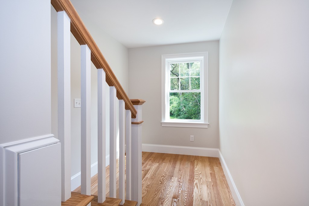 95 First Parish Road, Unit 1 Scituate, MA 02066 - Photo 16 of 24 a view of empty room with wooden floor and fan
