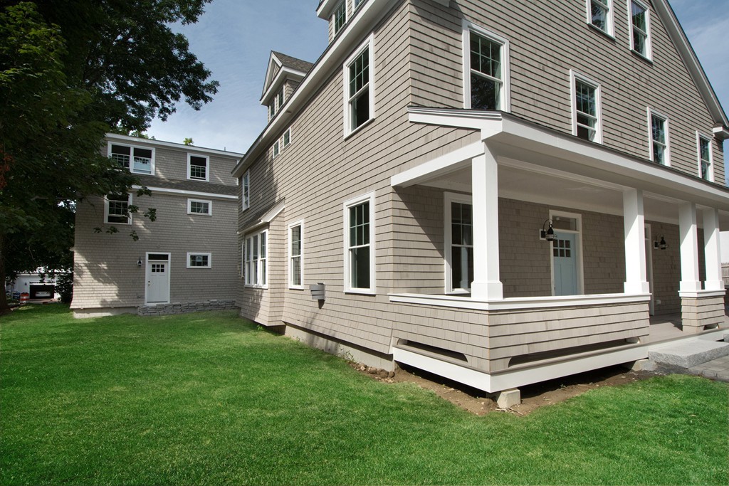 95 First Parish Road, Unit 1 Scituate, MA 02066 - Photo 2 of 24 a view of a house with a yard
