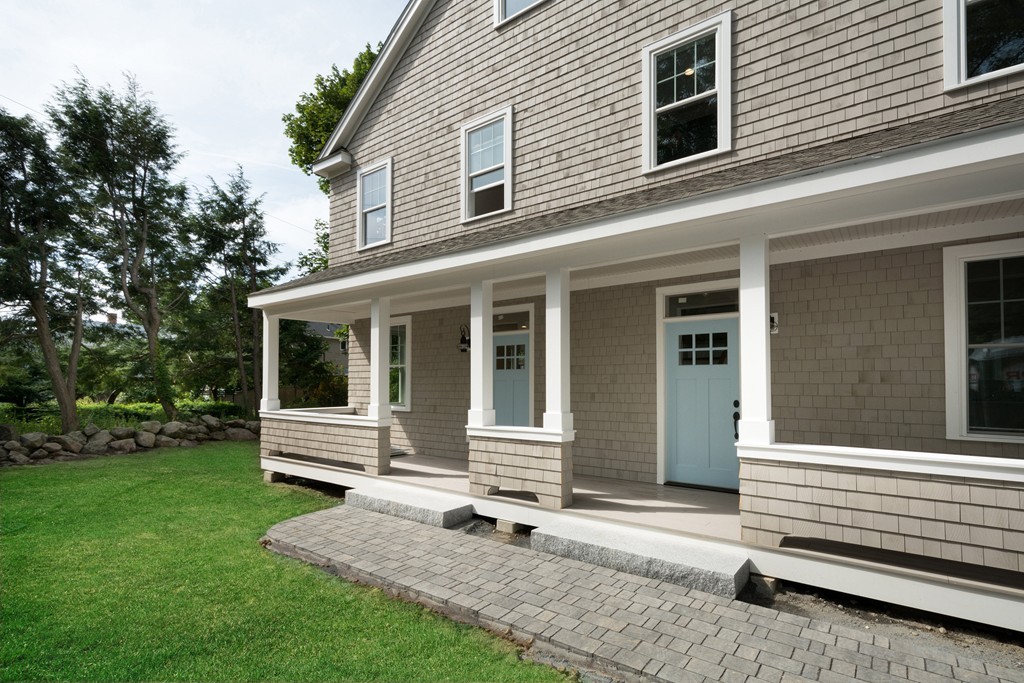 95 First Parish Road, Unit 1 Scituate, MA 02066 - Photo 4 of 24 a front view of a house with garden