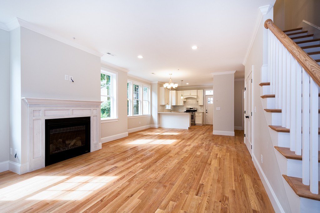 95 First Parish Road, Unit 1 Scituate, MA 02066 - Photo 7 of 24 a view of a kitchen with furniture and a fireplace