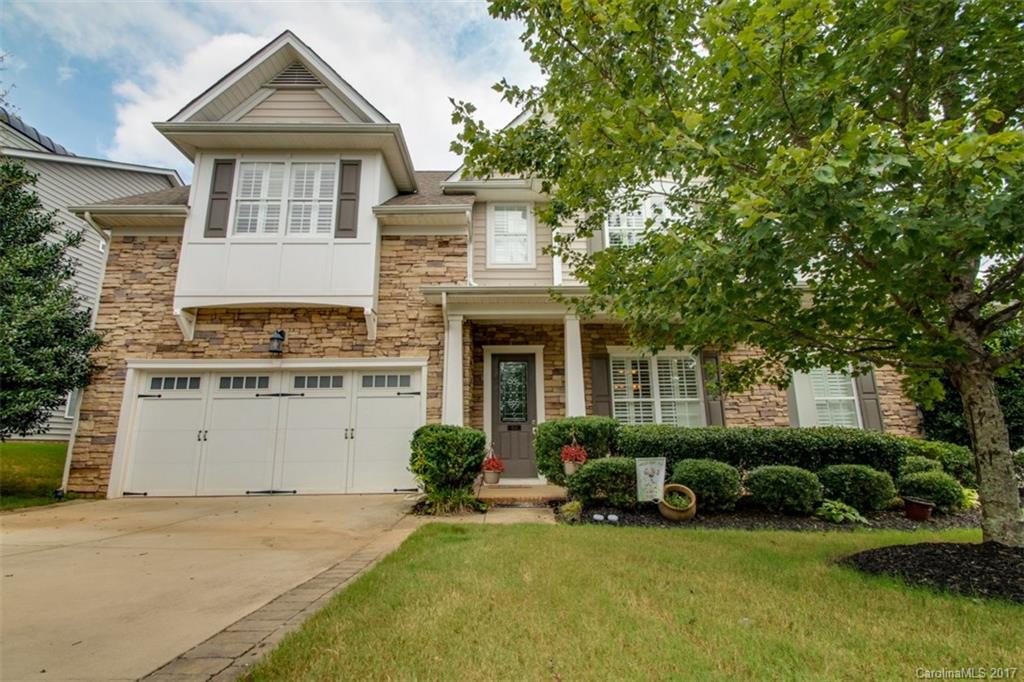 938 Treasure Court Fort Mill, SC 29708 - Photo 1 of 24 a front view of a house with a yard and garage