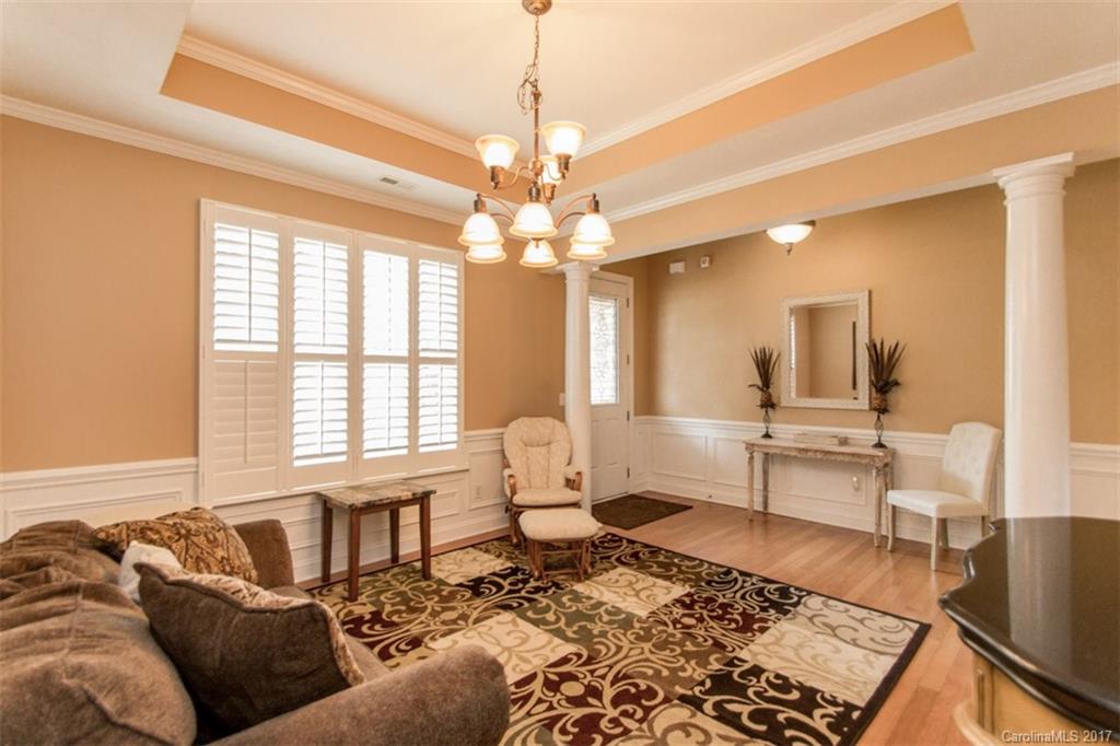 938 Treasure Court Fort Mill, SC 29708 - Photo 3 of 24 a living room with furniture and a chandelier
