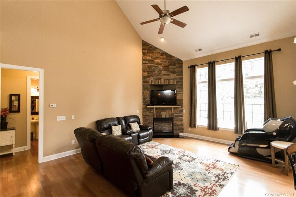 938 Treasure Court Fort Mill, SC 29708 - Photo 5 of 24 a living room with furniture and a flat screen tv