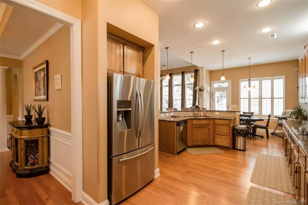 938 Treasure Court Fort Mill, SC 29708 - Photo 10 of 24 a kitchen with stainless steel appliances granite countertop a refrigerator stove top oven and sink
