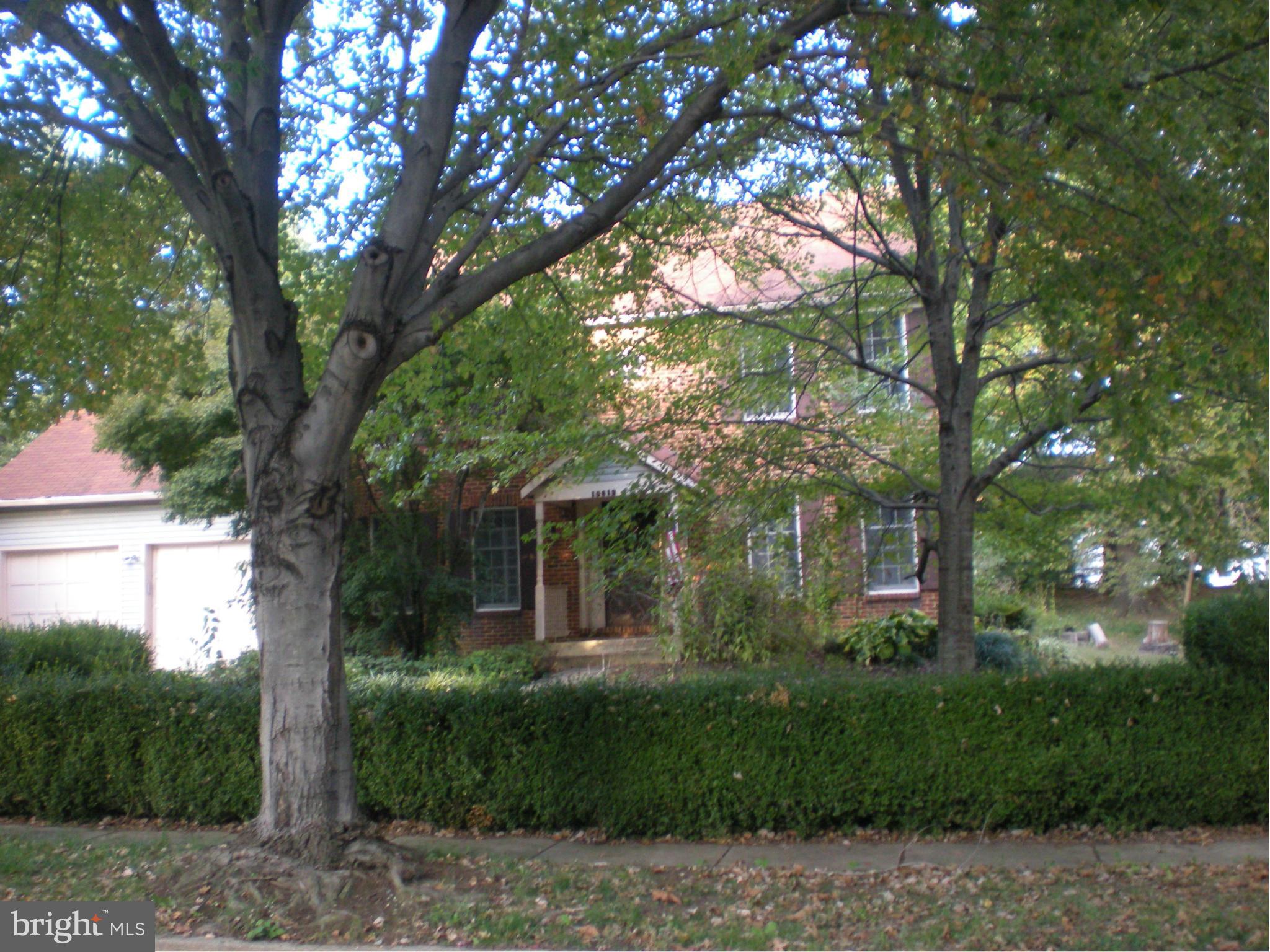 10812 Golf Course Terrace Bowie, MD 20721 - Photo 1 of 14 a view of a house with a tree