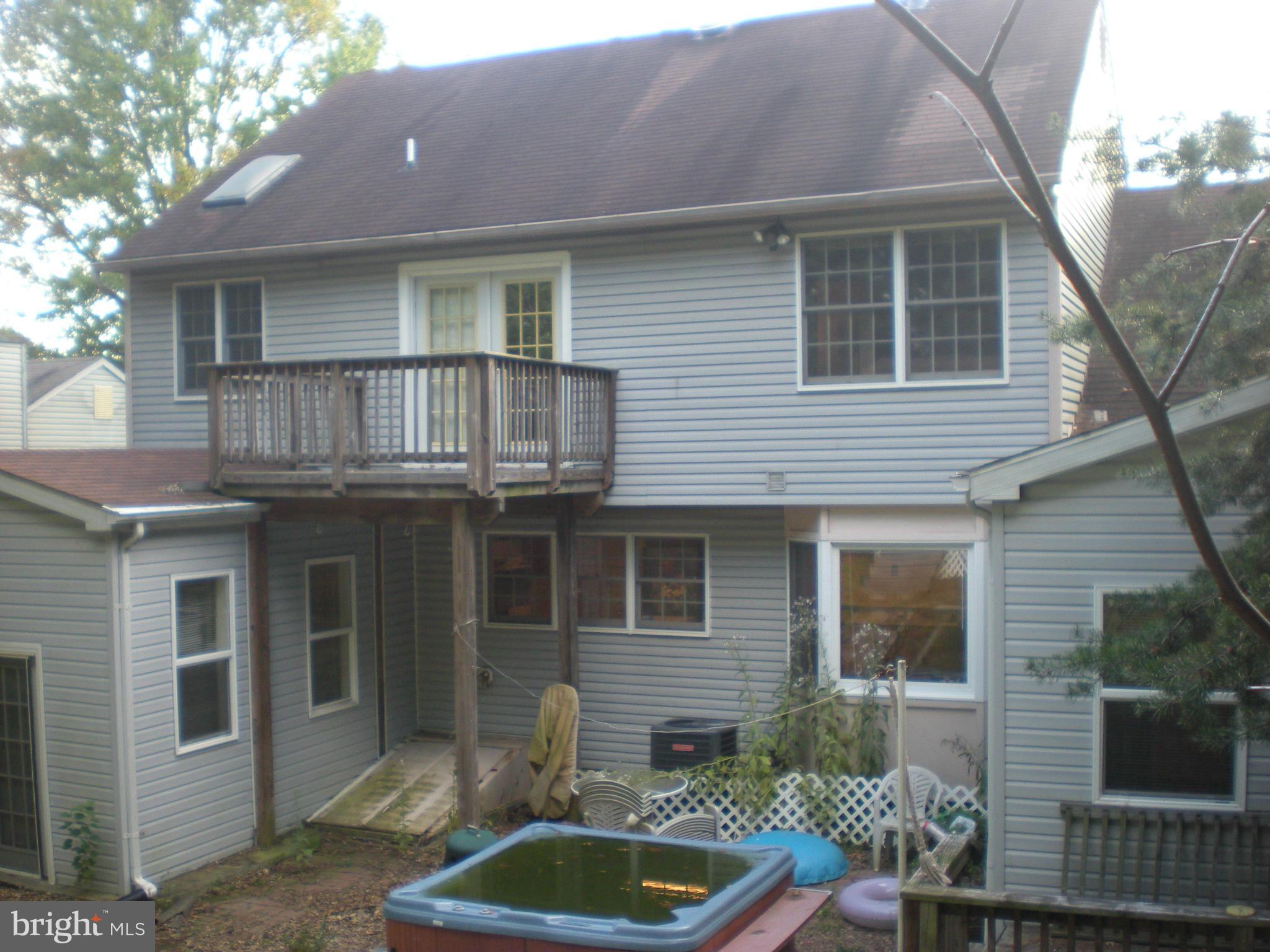 10812 Golf Course Terrace Bowie, MD 20721 - Photo 2 of 14 a front view of a house with balcony and garage