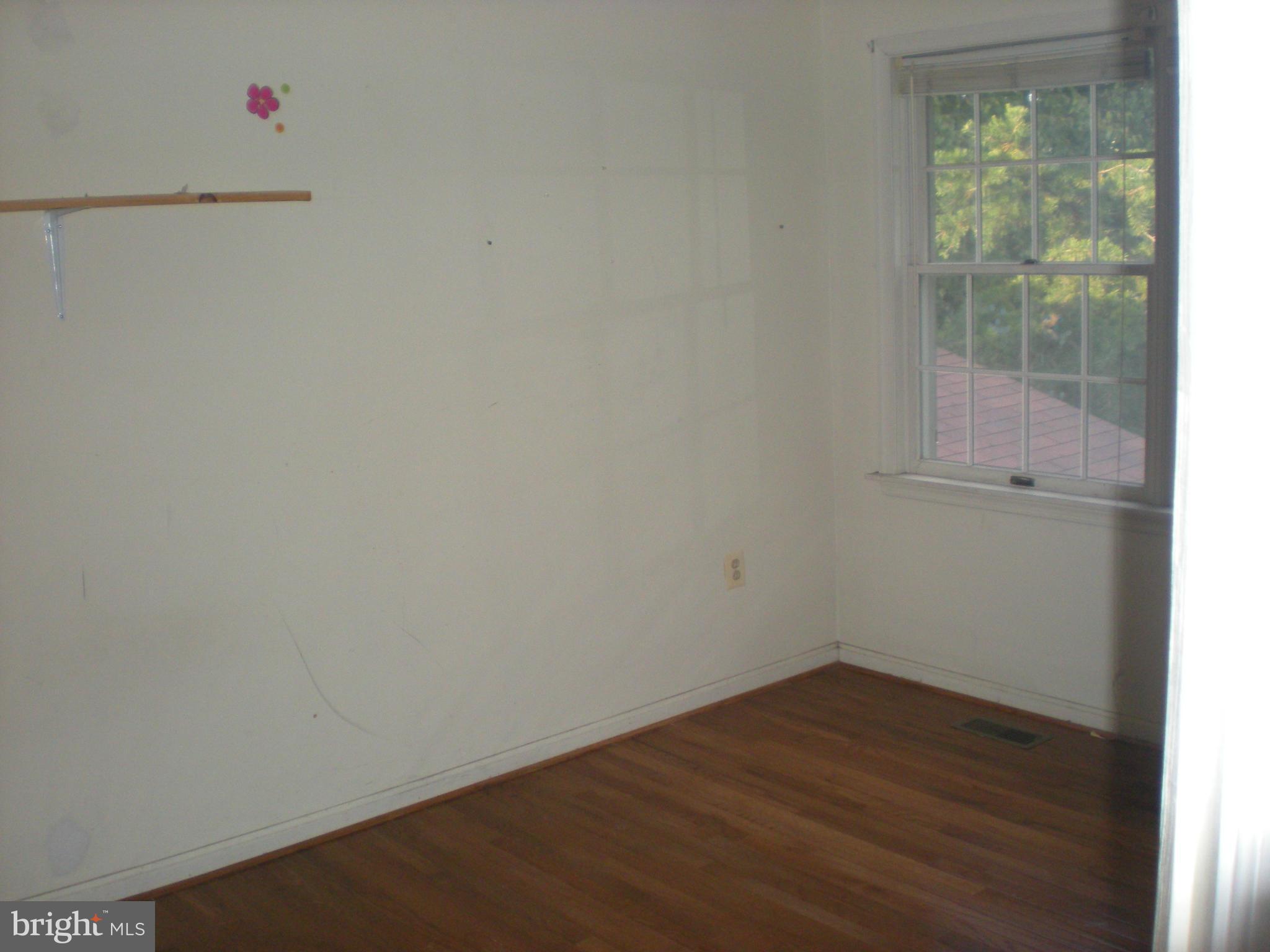 10812 Golf Course Terrace Bowie, MD 20721 - Photo 13 of 14 a view of a small space with wooden floor and a window
