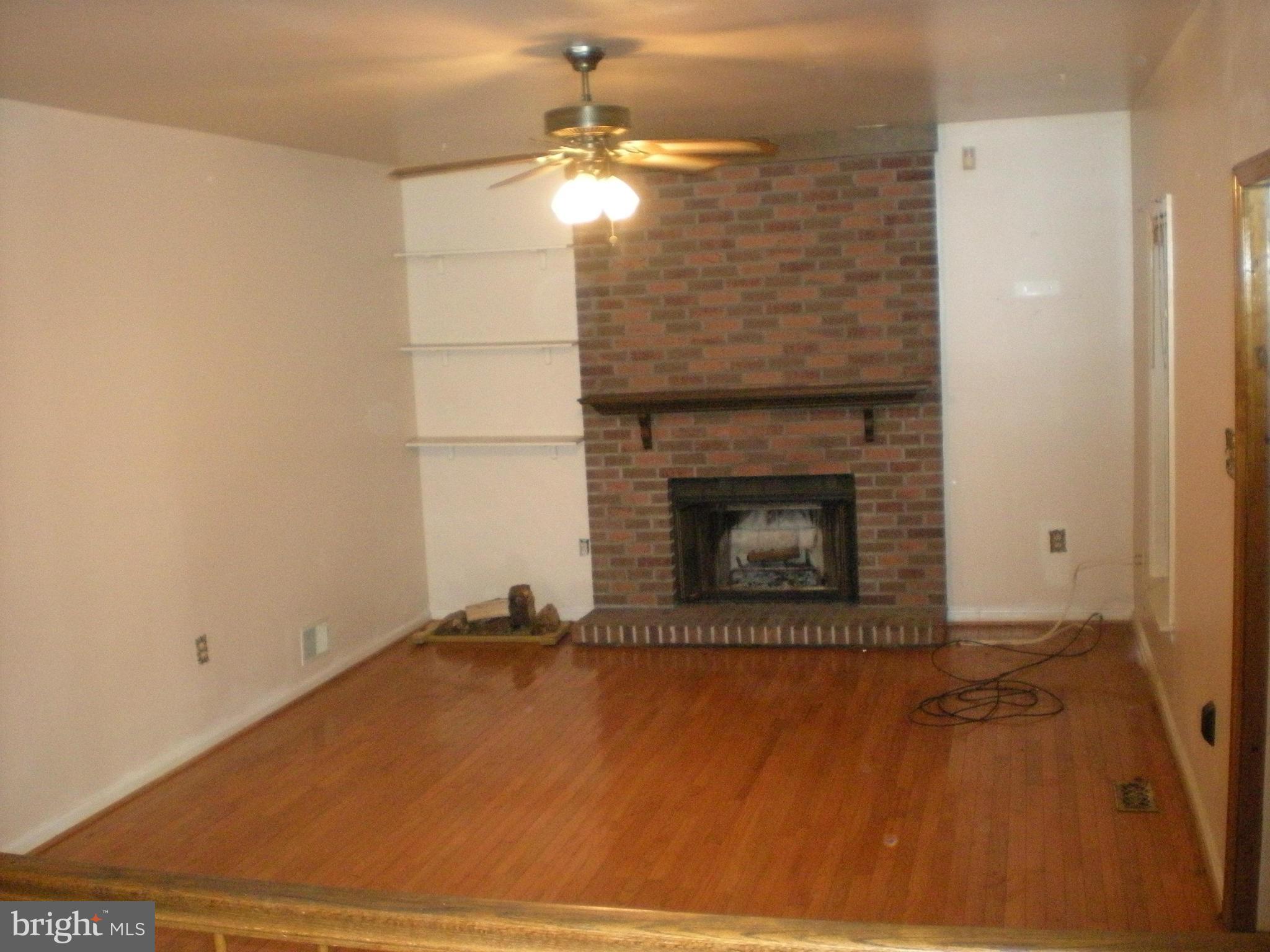 10812 Golf Course Terrace Bowie, MD 20721 - Photo 4 of 14 a room with a fireplace