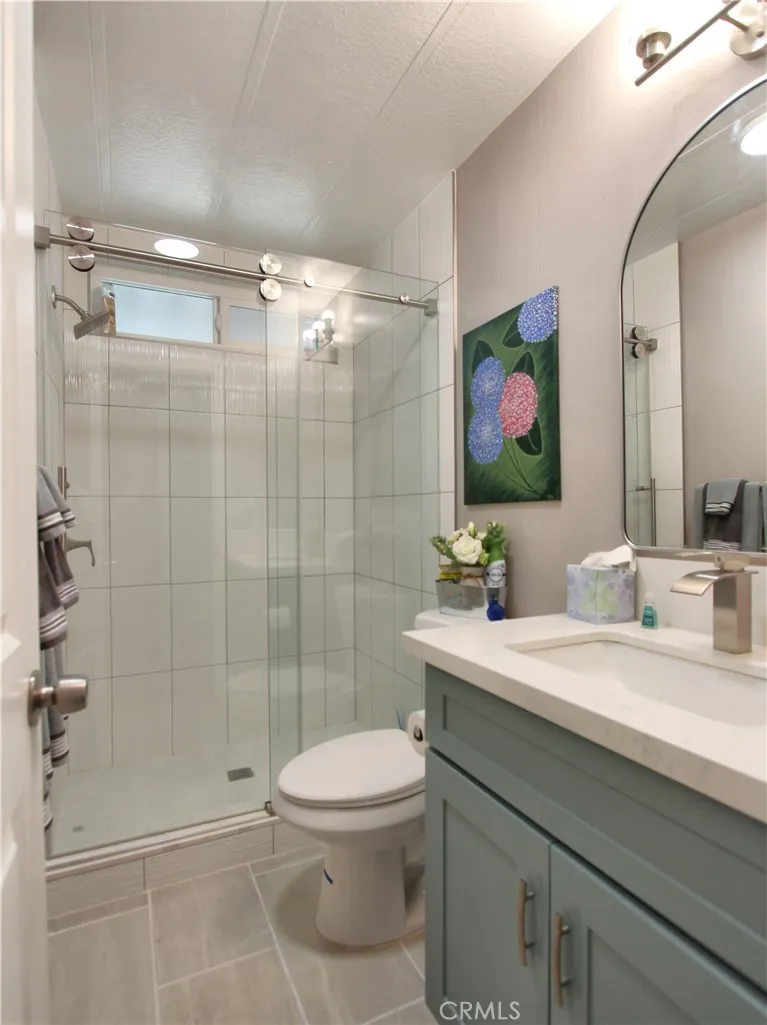 692 North Adele Street, Unit 101 Orange, CA 92867 - Photo 16 of 20 a bathroom with a sink a toilet and shower