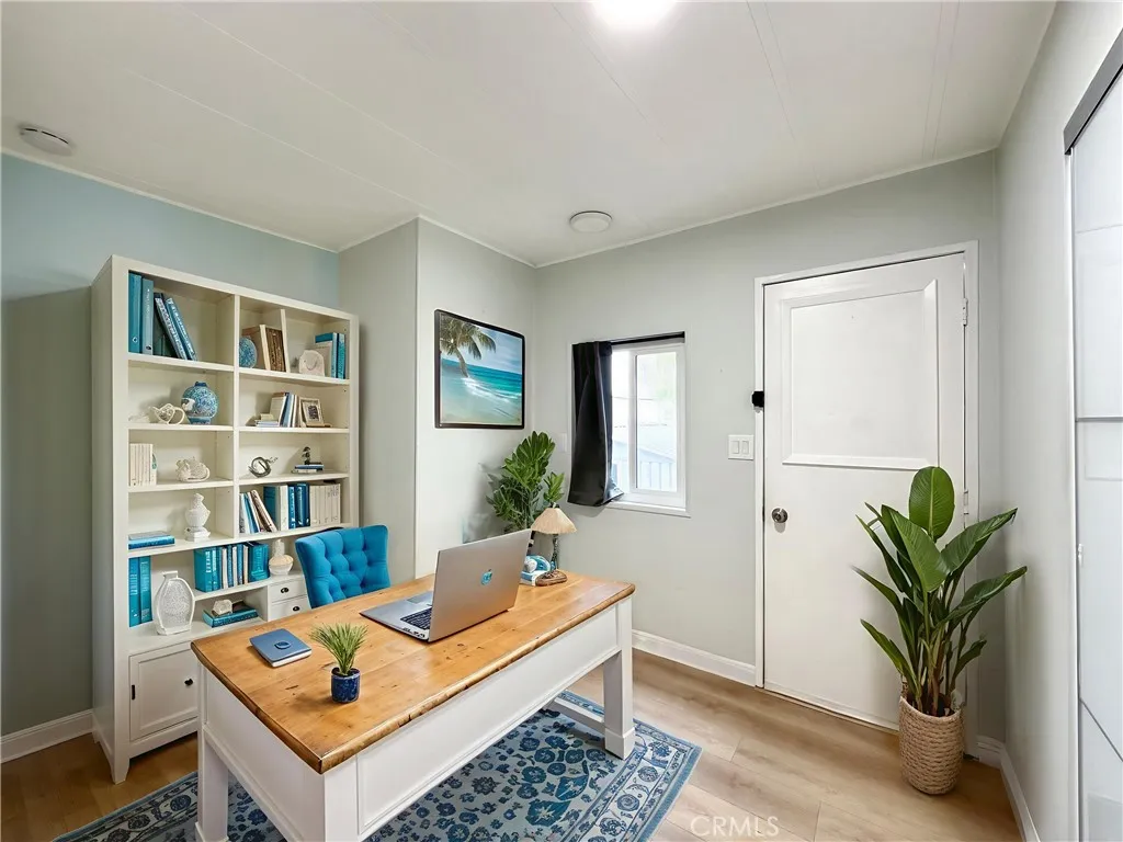 692 North Adele Street, Unit 101 Orange, CA 92867 - Photo 17 of 20 a living room with furniture and a potted plant