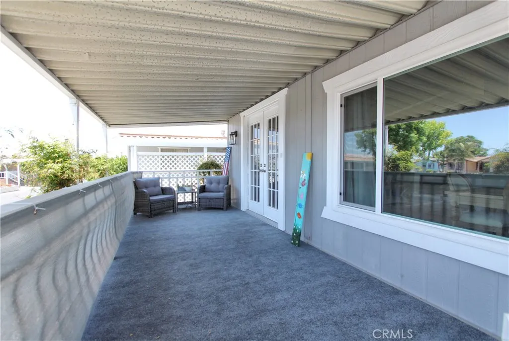 692 North Adele Street, Unit 101 Orange, CA 92867 - Photo 4 of 20 a view of a porch with furniture and floor to ceiling window