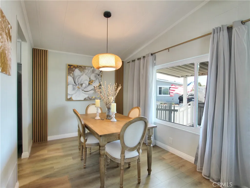 692 North Adele Street, Unit 101 Orange, CA 92867 - Photo 6 of 20 a view of a dining room with furniture window and wooden floor