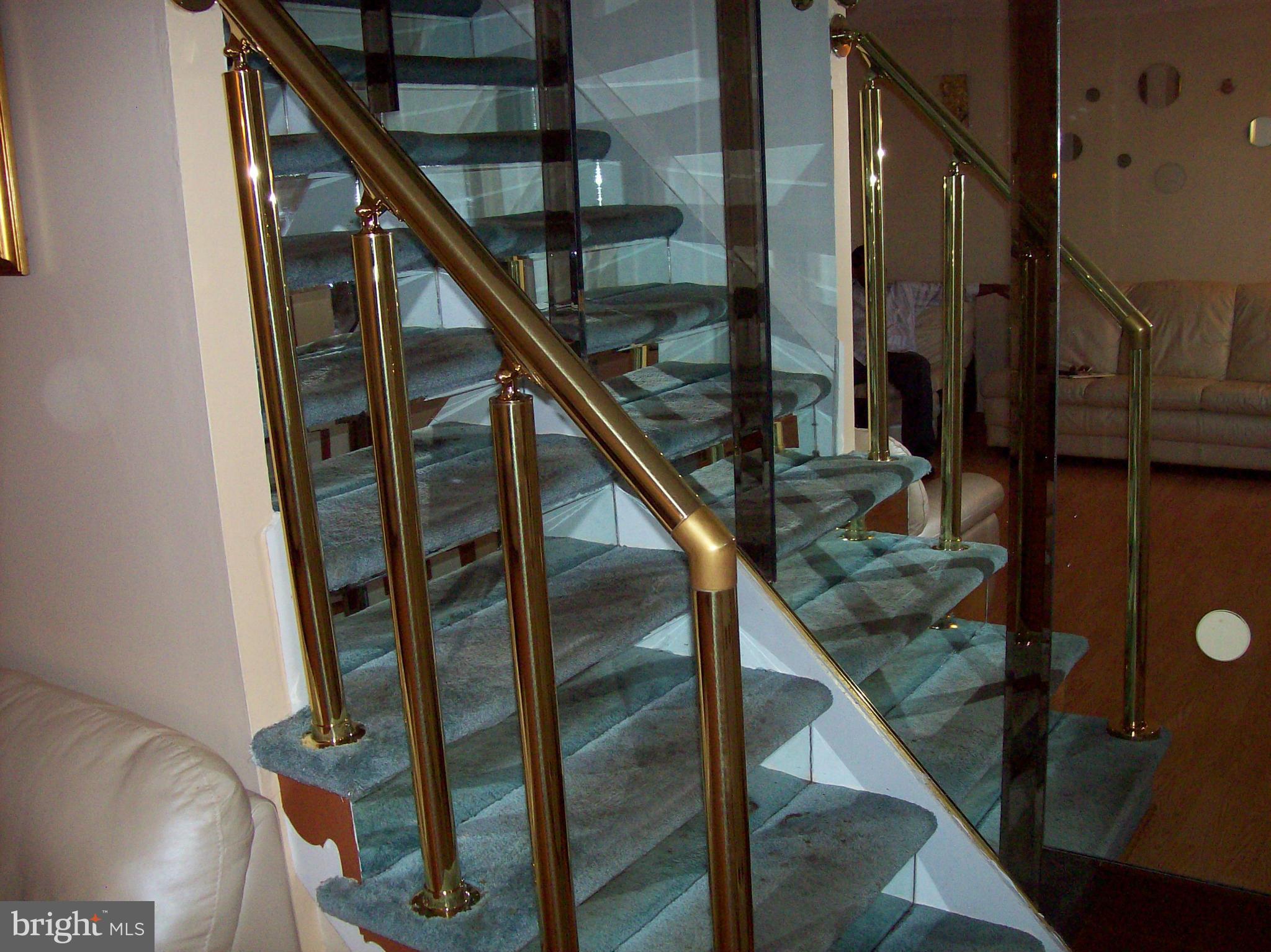 3664 Hilmar Road Baltimore, MD 21244 - Photo 8 of 19 Brass Railings & Mirror Walls Leading To Upstairs