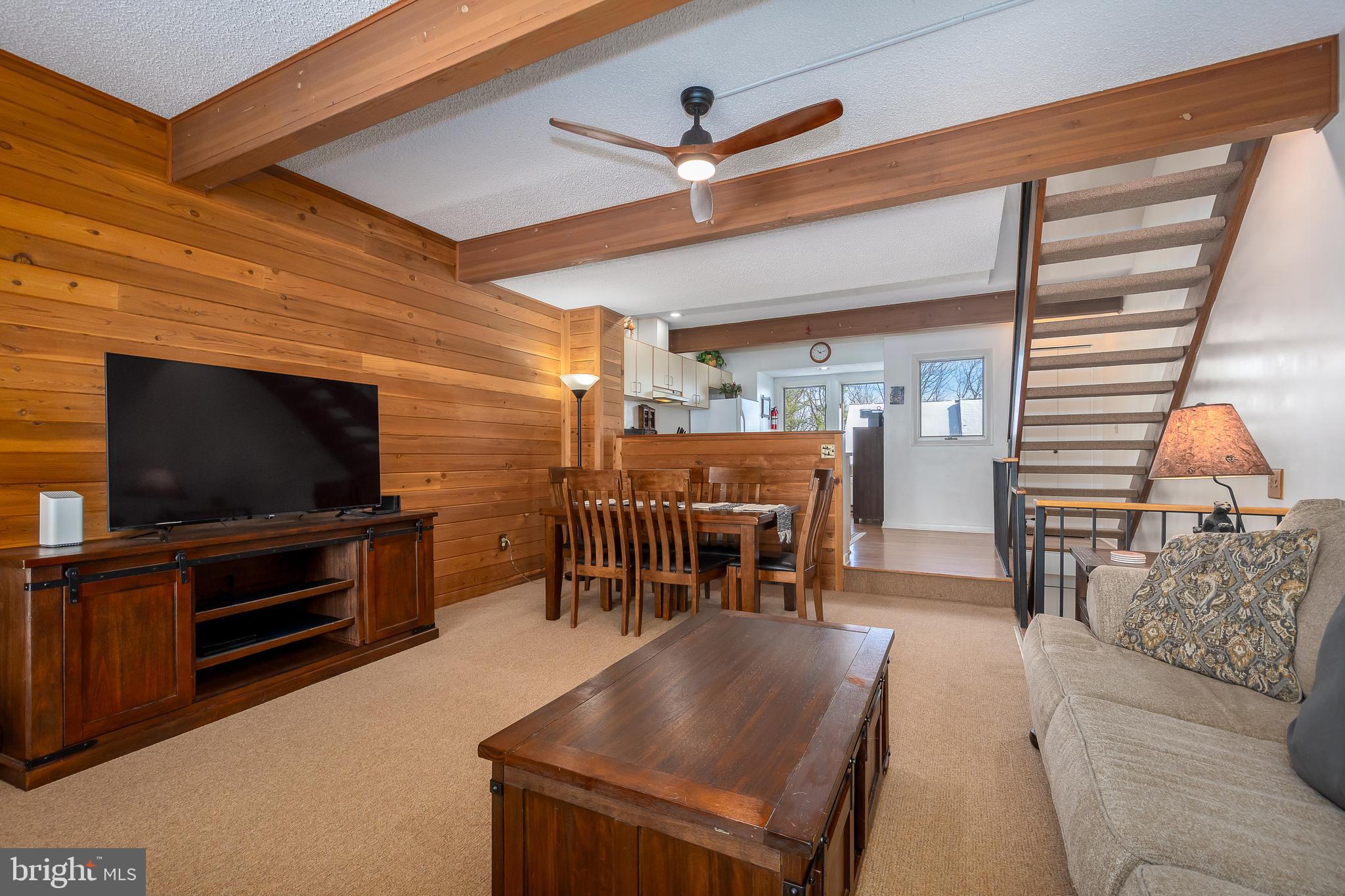 14 Winding Way, Unit 18B McHenry, MD 21541 - Photo 12 of 44 a living room with furniture and a flat screen tv