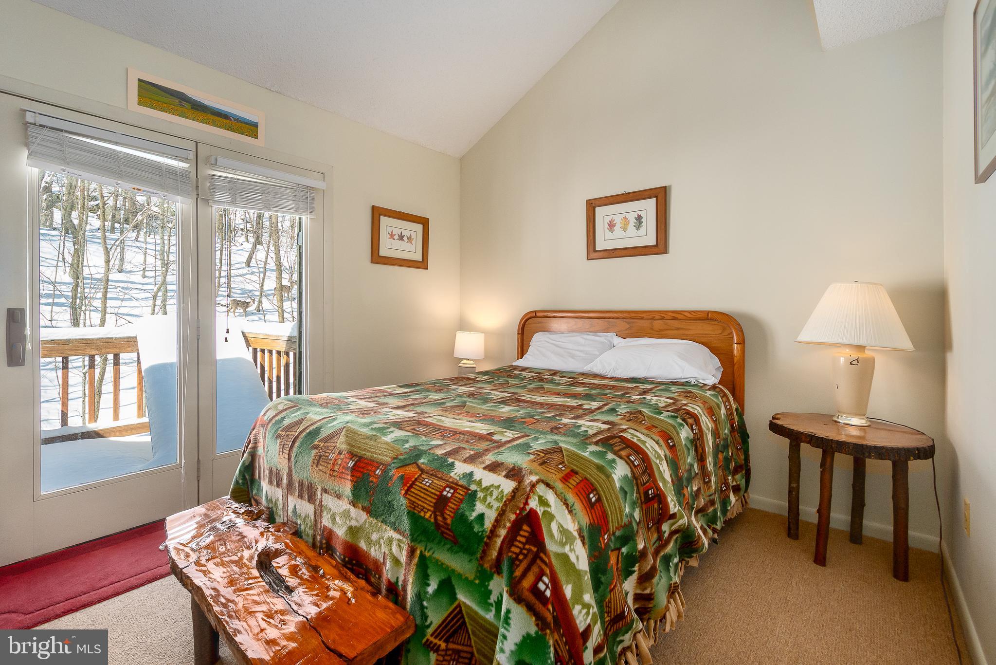 14 Winding Way, Unit 18B McHenry, MD 21541 - Photo 15 of 44 a bedroom with a bed and wooden floor