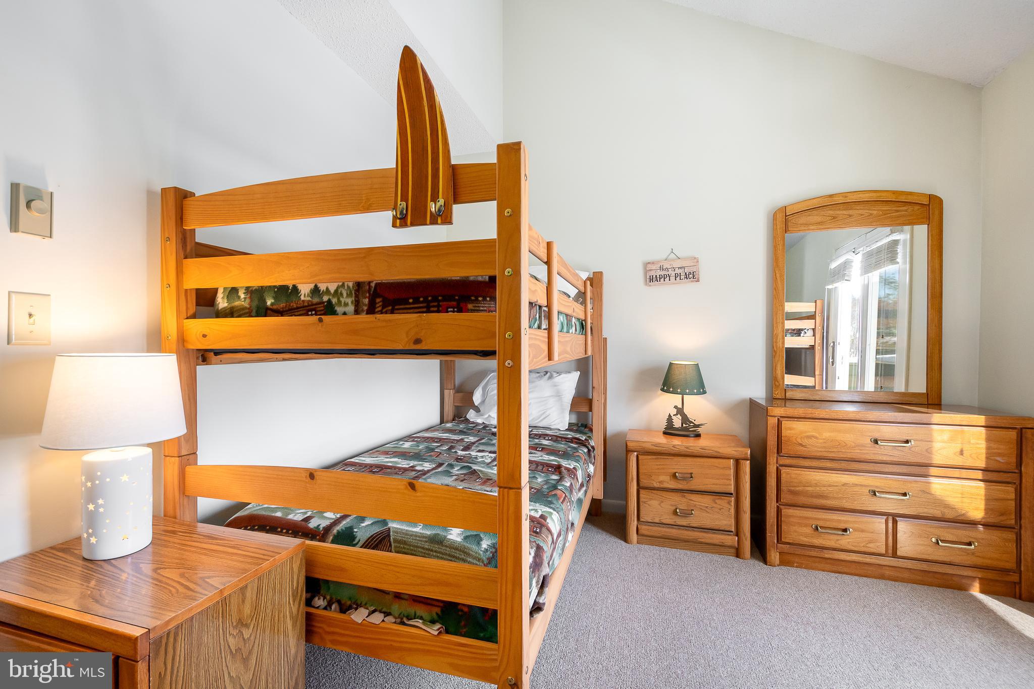 14 Winding Way, Unit 18B McHenry, MD 21541 - Photo 18 of 44 a view of a bedroom with furniture and a bed