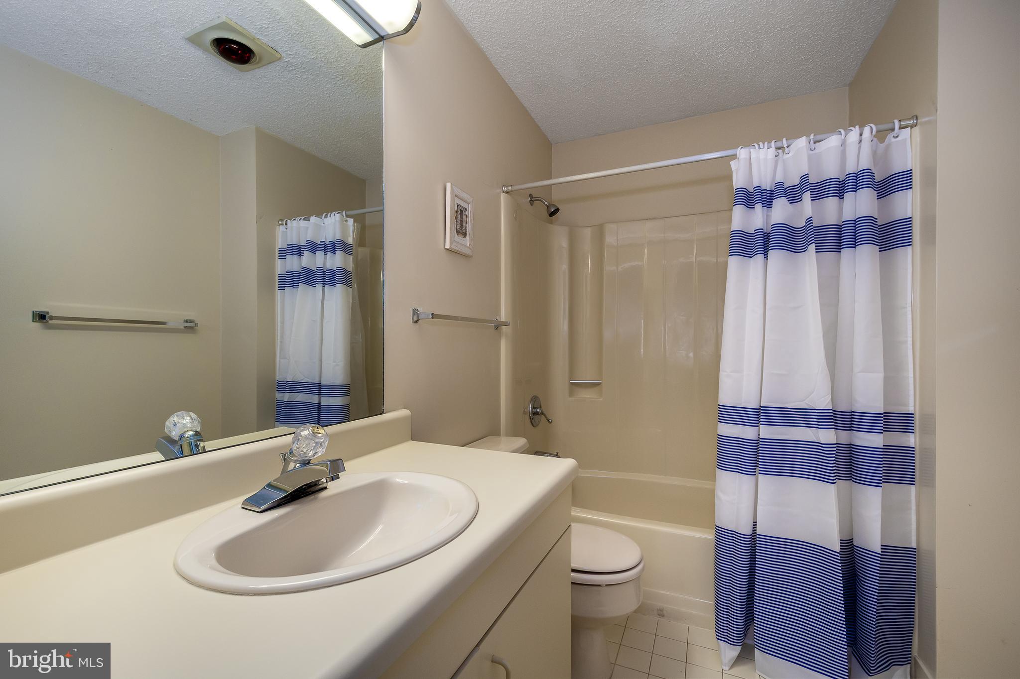 14 Winding Way, Unit 18B McHenry, MD 21541 - Photo 22 of 44 a bathroom with a sink toilet and shower