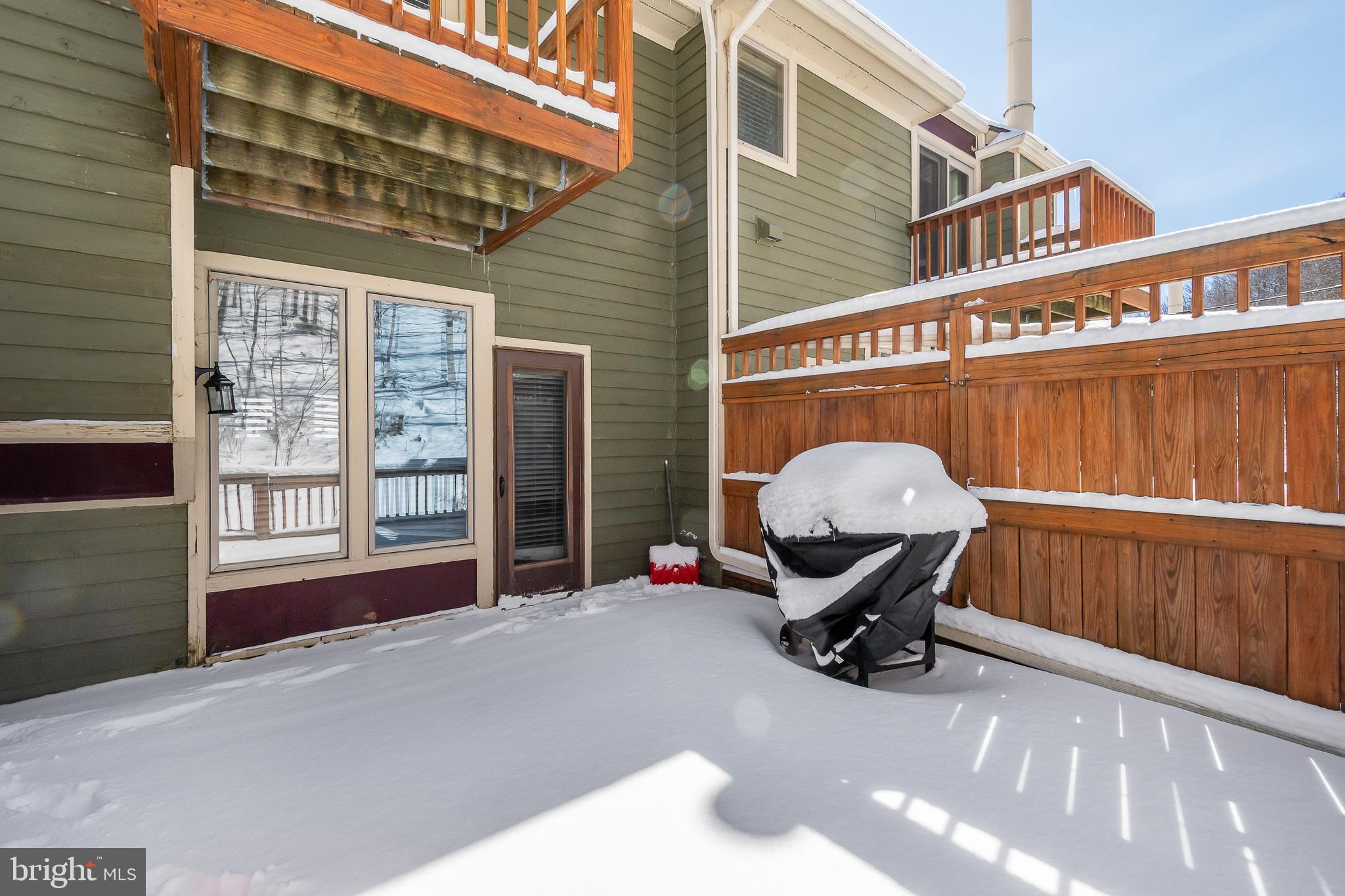 14 Winding Way, Unit 18B McHenry, MD 21541 - Photo 24 of 44 a view of a chairs and table in the balcony