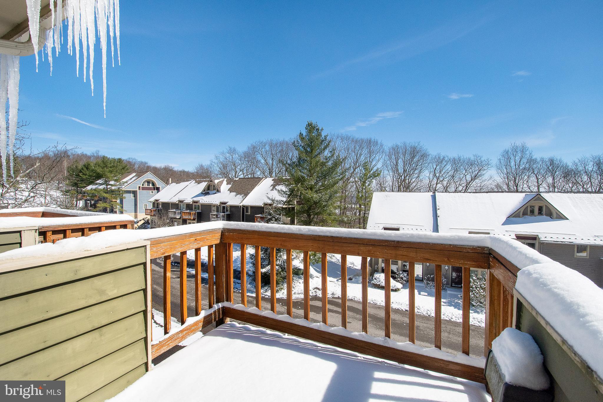 14 Winding Way, Unit 18B McHenry, MD 21541 - Photo 27 of 44 a view of a balcony with wooden floor and fence