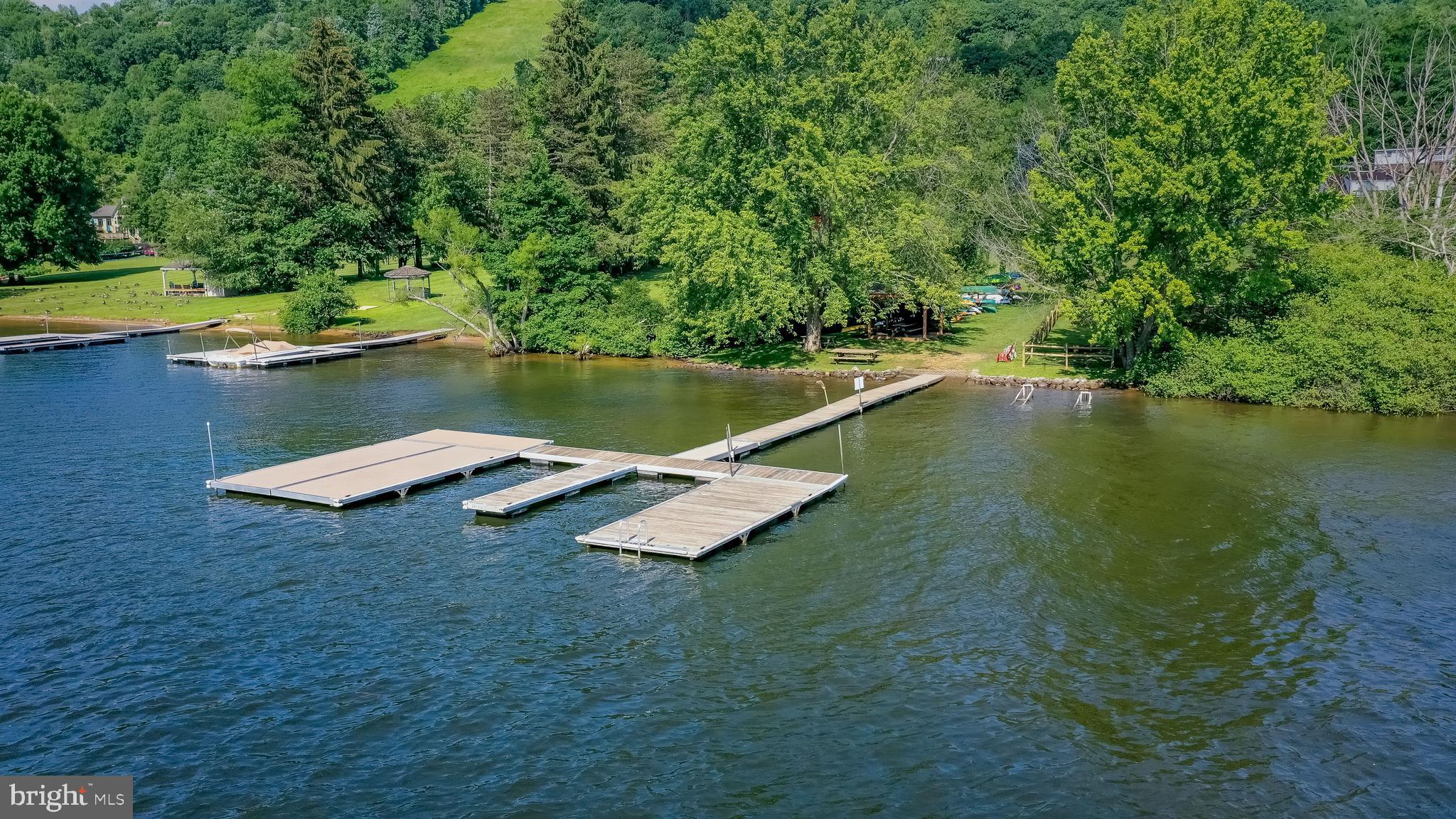 14 Winding Way, Unit 18B McHenry, MD 21541 - Photo 30 of 44 a view of a lake with a yard and large trees