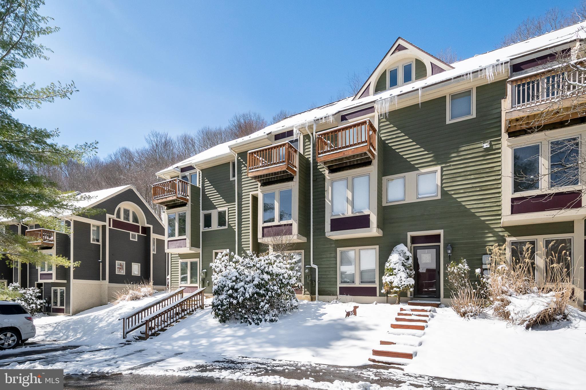 14 Winding Way, Unit 18B McHenry, MD 21541 - Photo 5 of 44 a front view of a house with a yard