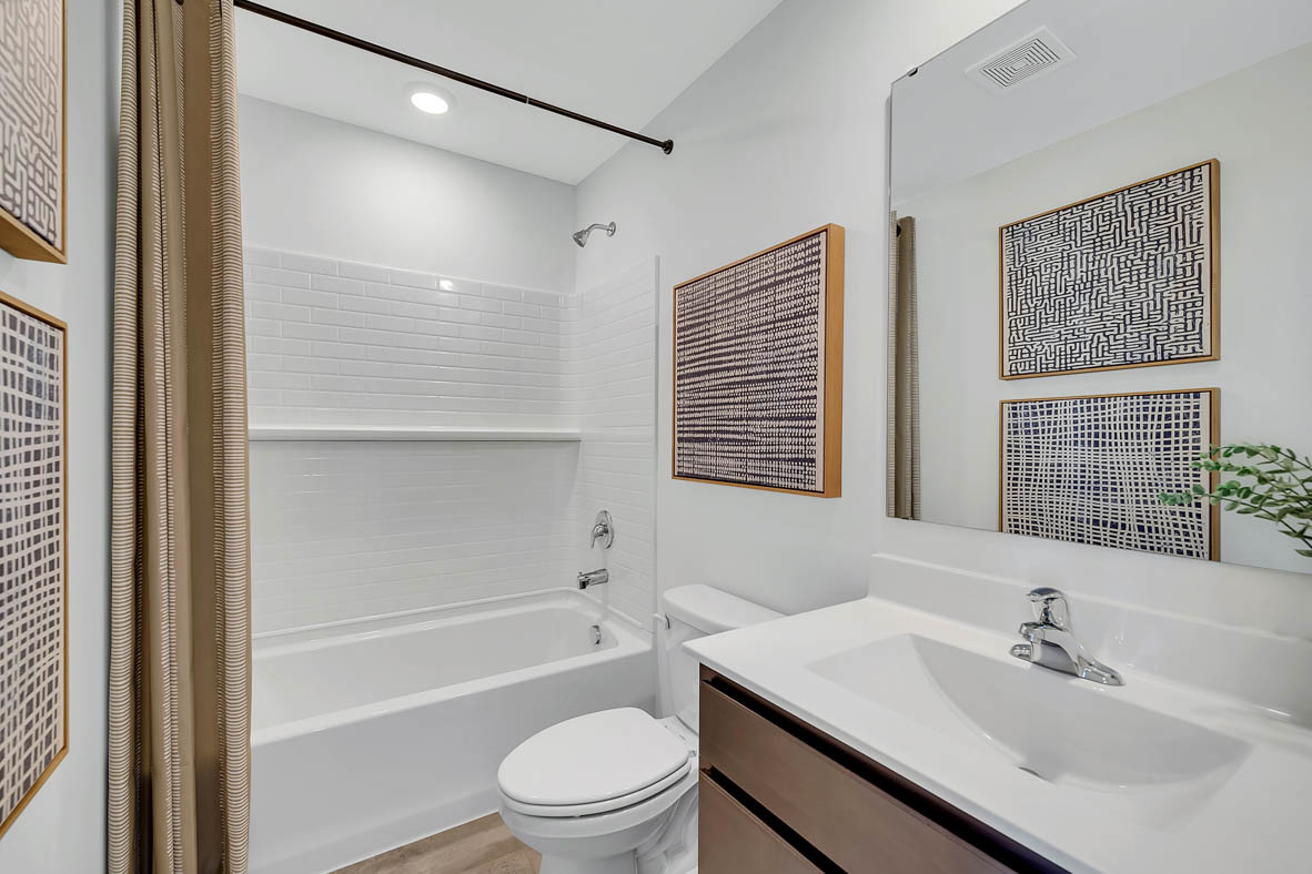 384 Summit Circle Lombard, IL 60148 - Photo 14 of 37 a bathroom with a sink toilet a mirror and shower