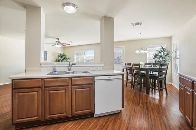 a kitchen with a sink and cabinets