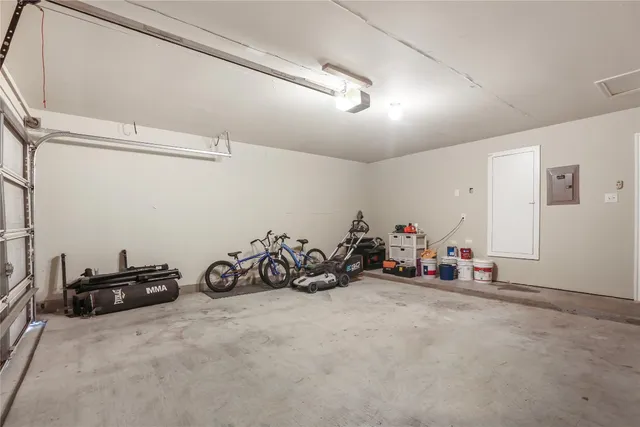 a view of a garage with rack and bicycle