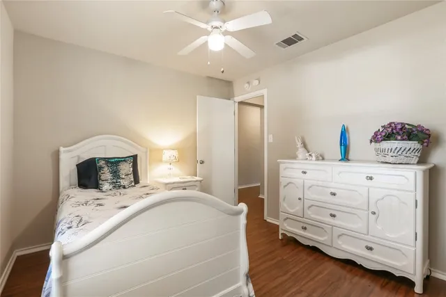 a bedroom with a bed and a fireplace