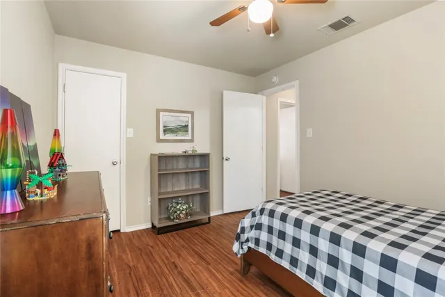 a bedroom with a bed and a dresser