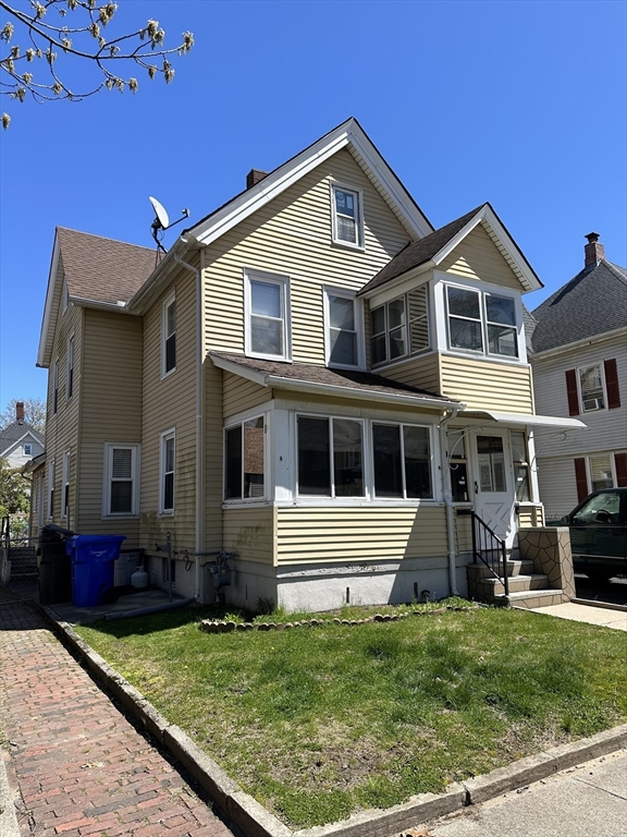 9 Prince Street Springfield, MA 01109 - Photo 1 of 18 a front view of a house with a yard