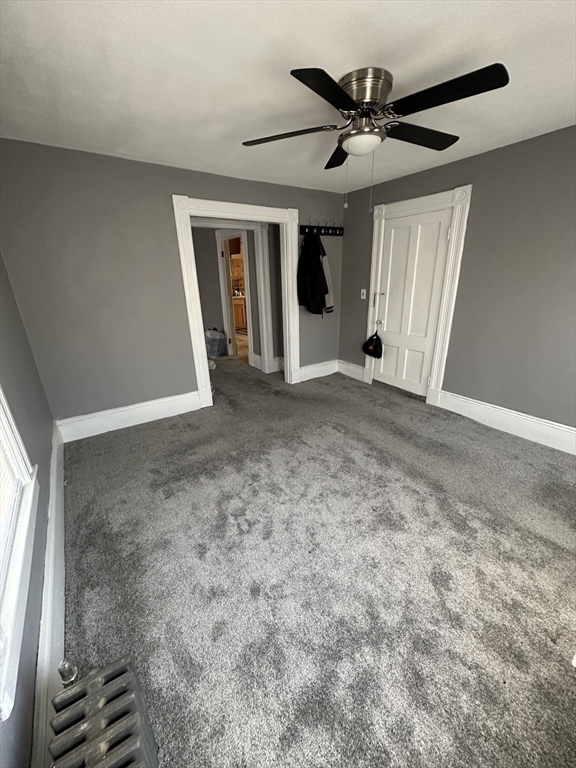 9 Prince Street Springfield, MA 01109 - Photo 14 of 18 a view of an empty room with a ceiling fan