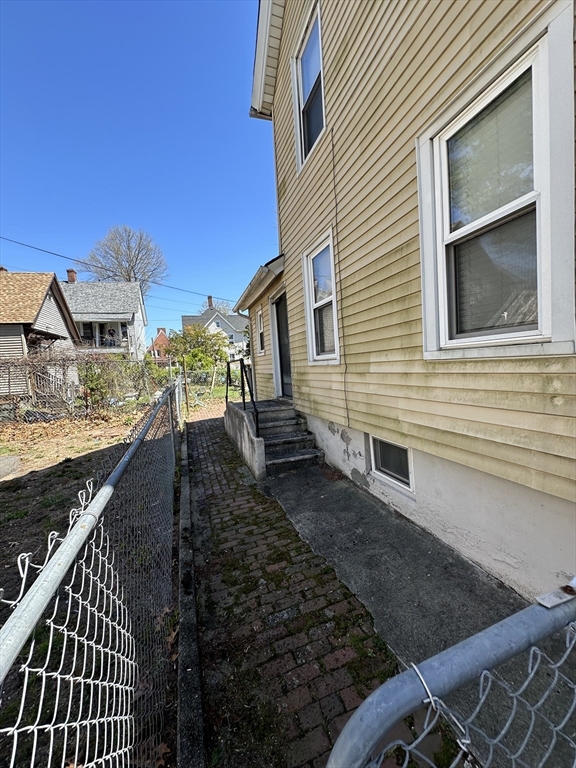 9 Prince Street Springfield, MA 01109 - Photo 3 of 18 a view of a house with a yard