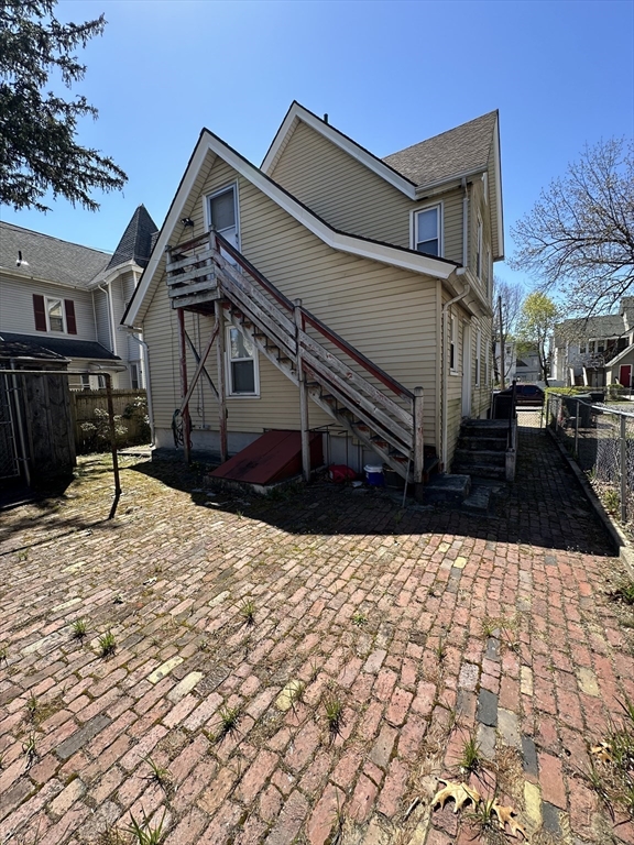 9 Prince Street Springfield, MA 01109 - Photo 4 of 18 a view of a house with a yard