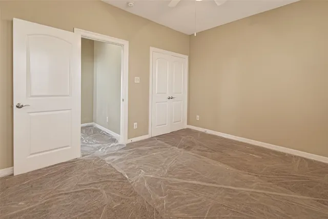a view of a livingroom with wooden floor and stairs