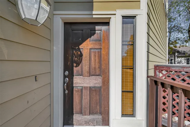 a view of entryway with stairs and a rug