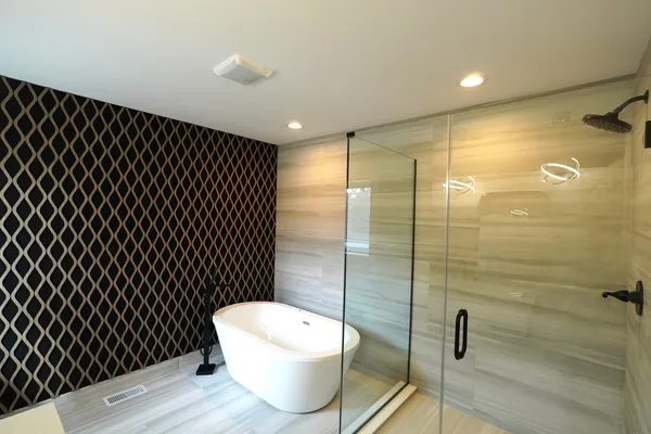 a bathroom with a toilet and a shower
