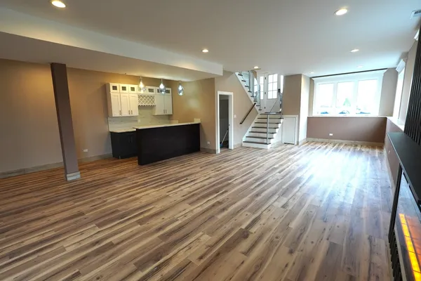 a view of a living room and wooden floor