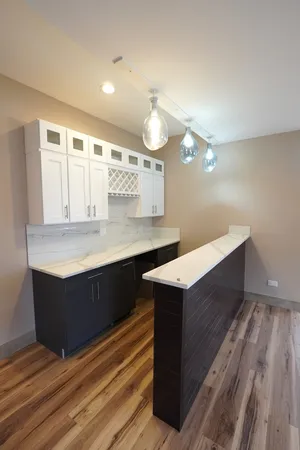 a bathroom with a sink vanity and a mirror