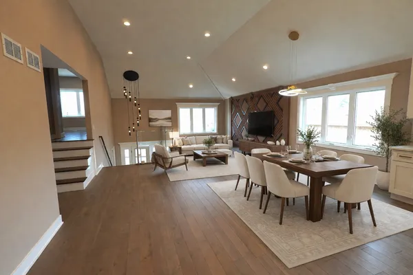 a view of a dining room with furniture and wooden floor