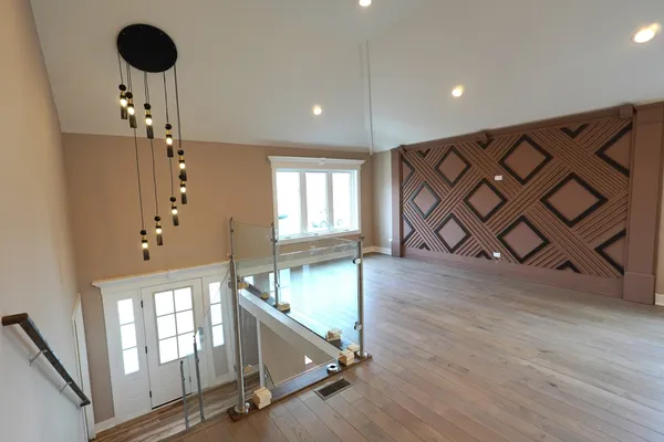 a view of an entryway with wooden floor