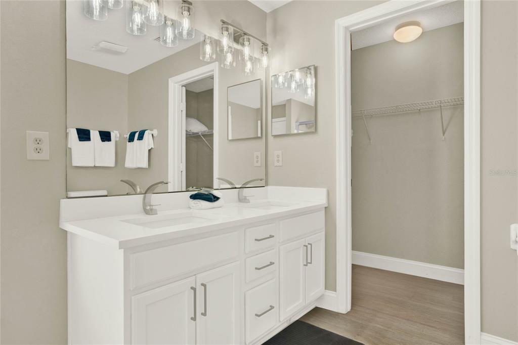188 Ridgemont Court Davenport, FL 33896 - Photo 16 of 38 a spacious bathroom with a double vanity sink mirror and