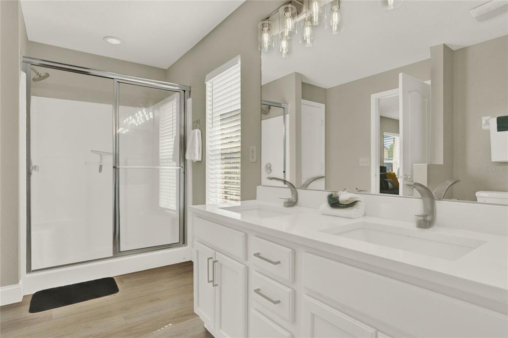 188 Ridgemont Court Davenport, FL 33896 - Photo 17 of 38 a bathroom with a granite countertop sink mirror and double