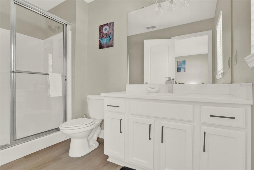 188 Ridgemont Court Davenport, FL 33896 - Photo 23 of 38 a bathroom with a sink toilet and shower