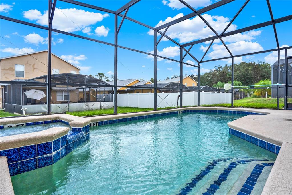 188 Ridgemont Court Davenport, FL 33896 - Photo 28 of 38 a view of a swimming pool with a lounge chairs