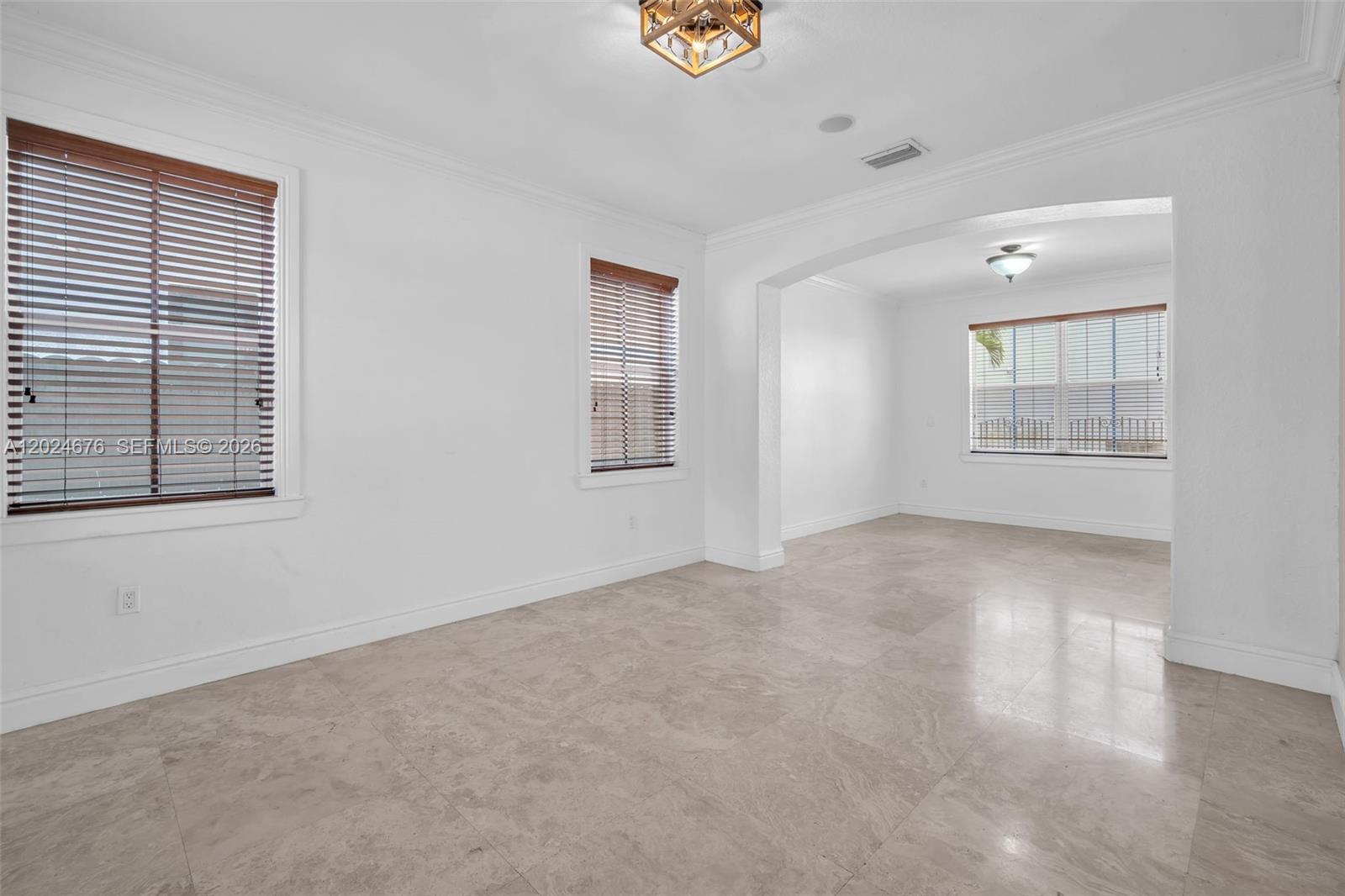 2155 Southwest 156th Court Miami, FL 33185 - Photo 13 of 57 a view of an empty room with a window
